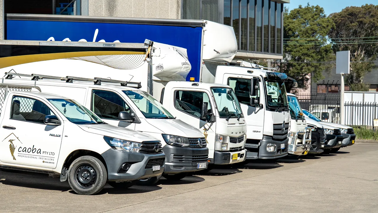 Utes, vans and trucks from the fleet lined up outside the warehouse